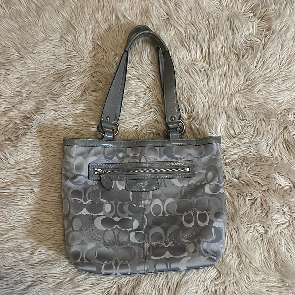 Grey Coach “C” cloth bag with grey leather details.